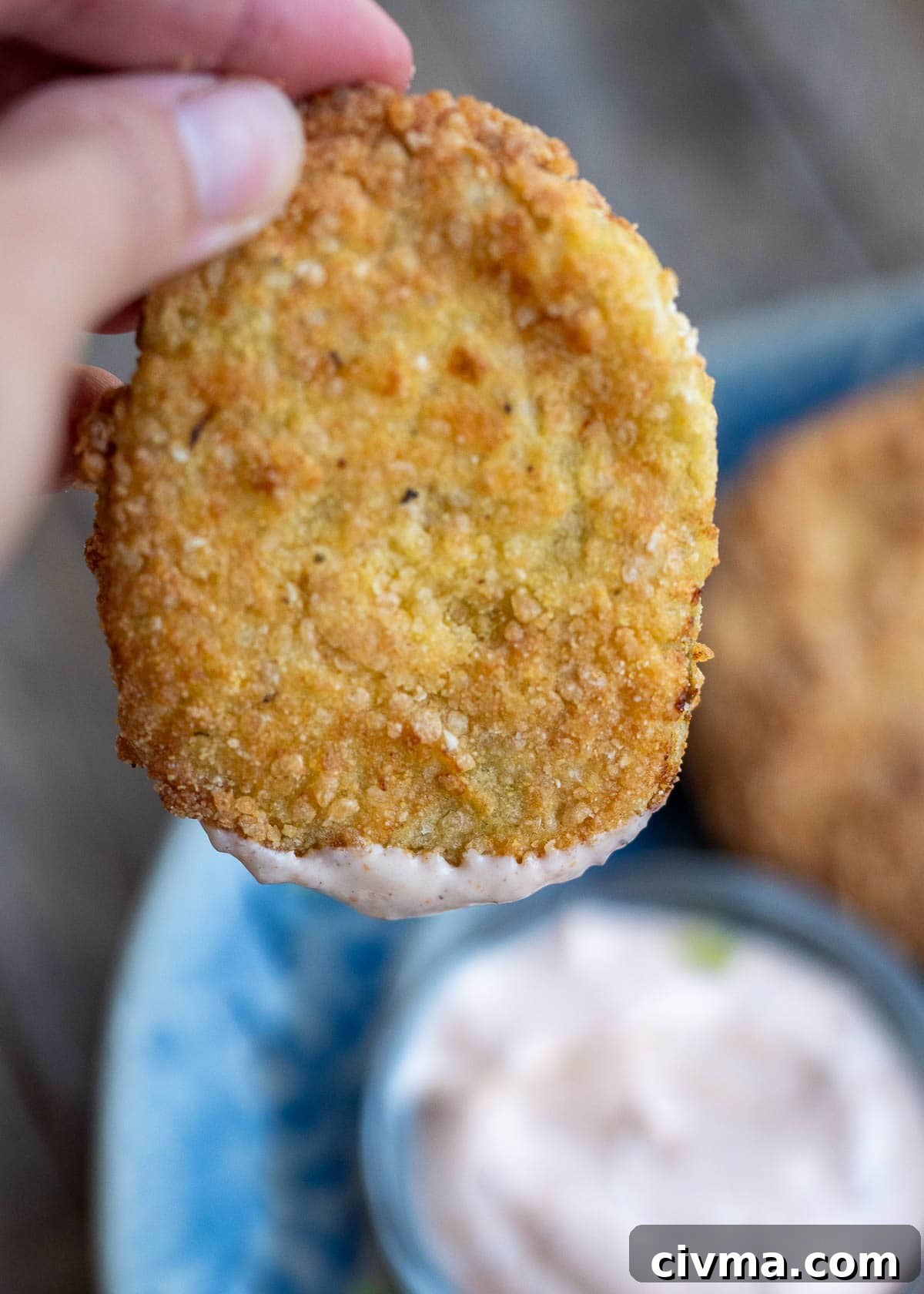 a crunchy fried green tomato dipped in remoulade