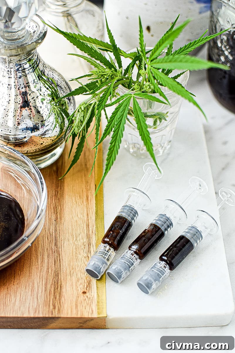 A white countertop with a white and wood cutting board topped with three FECO syringes 