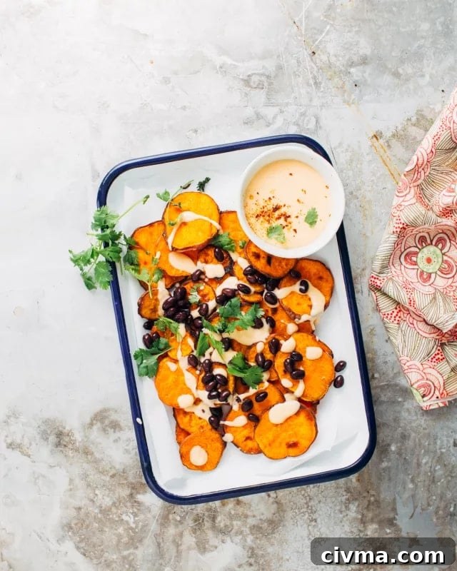 Plated sweet potato nachos with cheese sauce