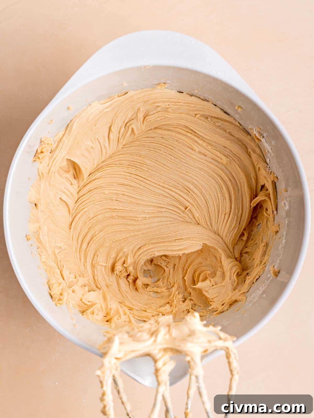 Peanut butter and honey buttercream mixed in a bowl.