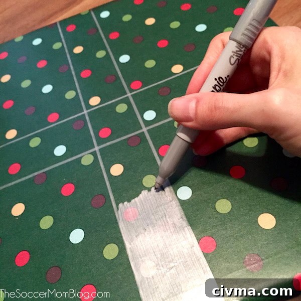 A variety of hand-drawn metallic designs on wrapped gifts