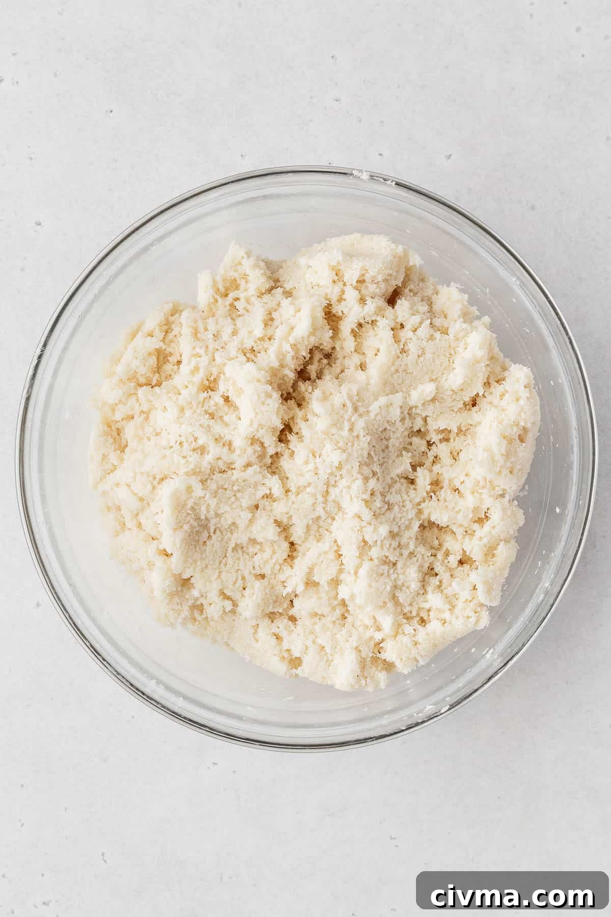 Vegan coconut macaroon dough in a glass bowl.