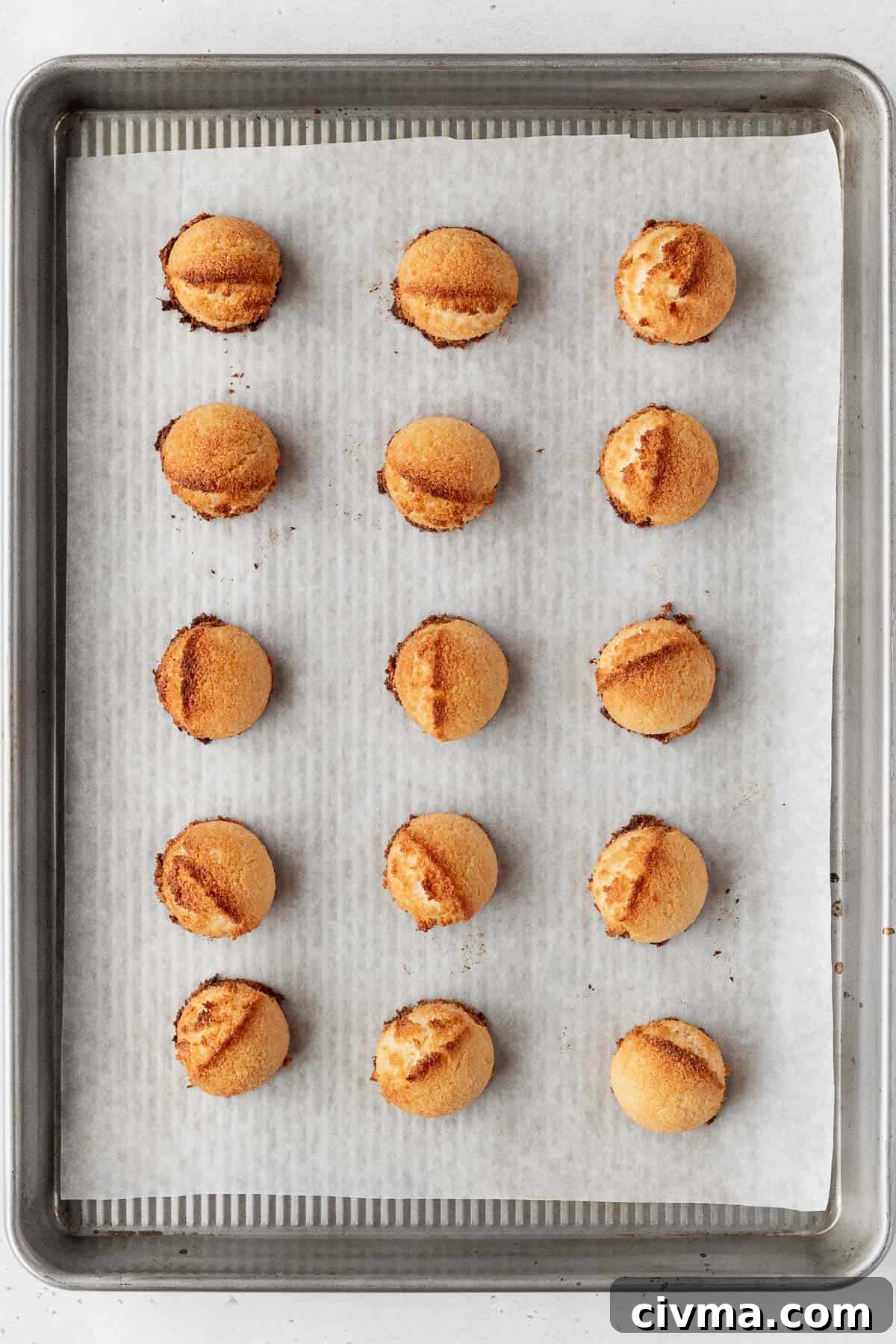 Vegan coconut macaroons after baking on a baking sheet.