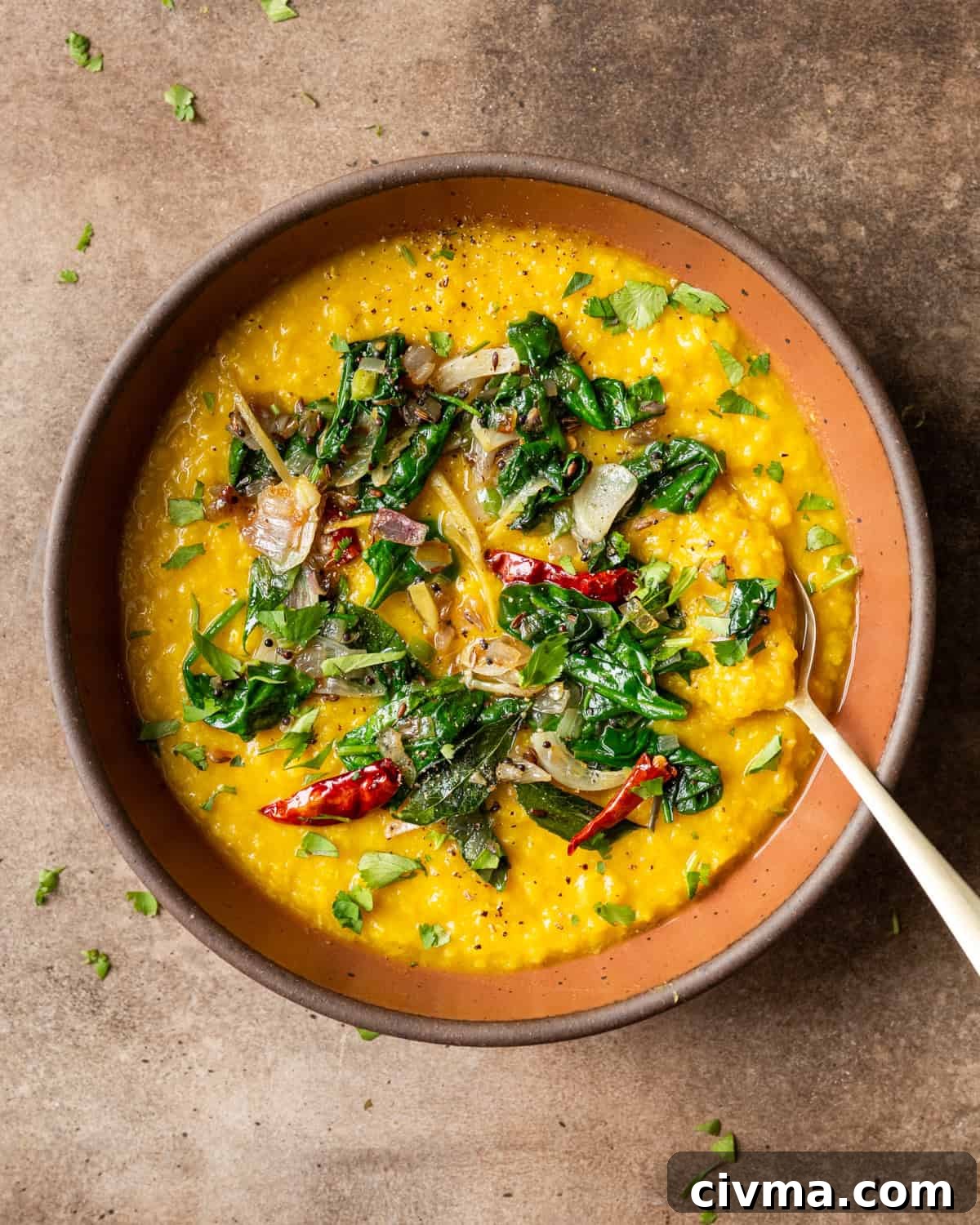 Dal palak in bowl on a table.