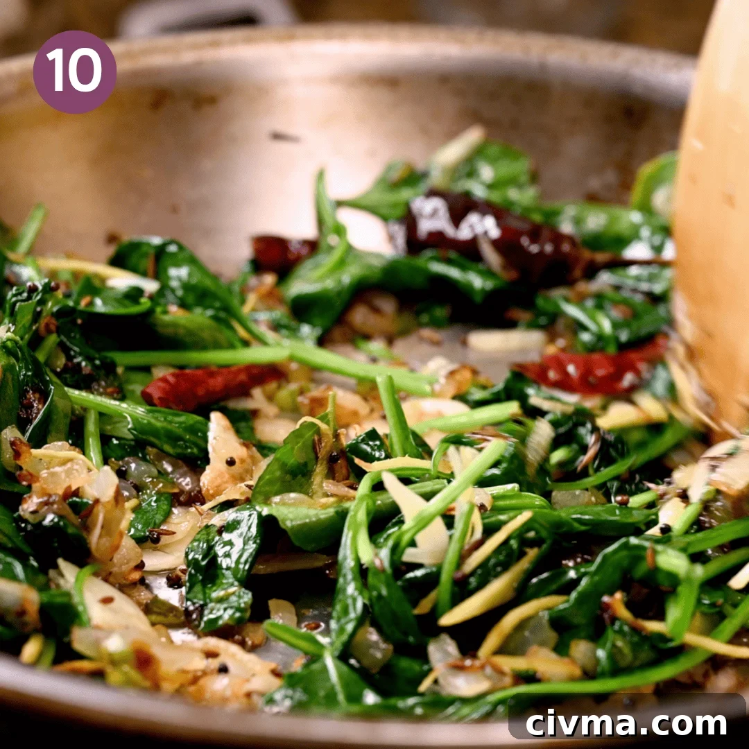 spinach wilted down into aromatic mixture.