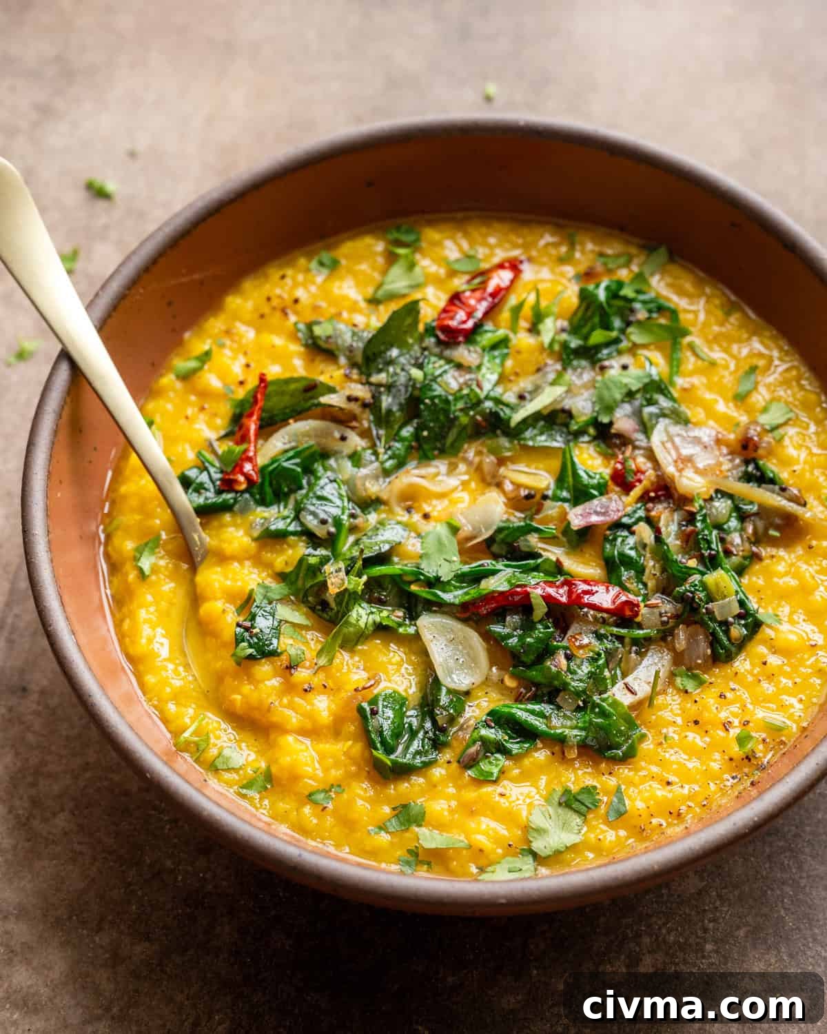 Dal palak in bowl on a table.