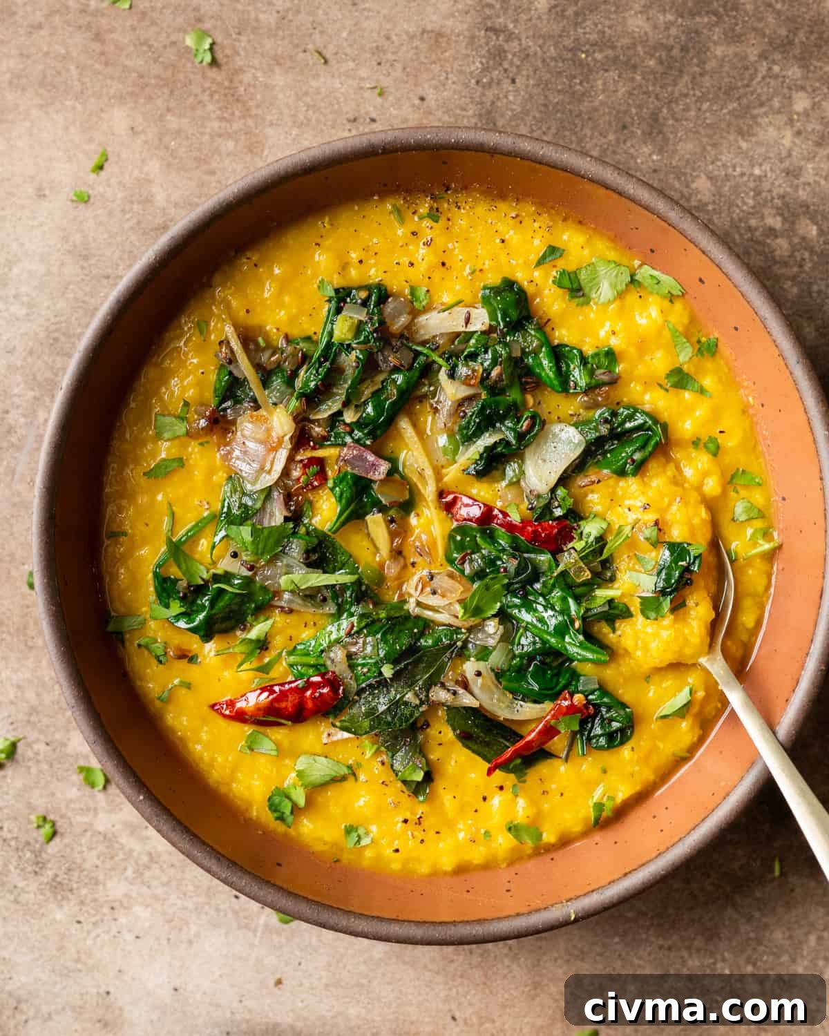Dal palak in bowl on a table.