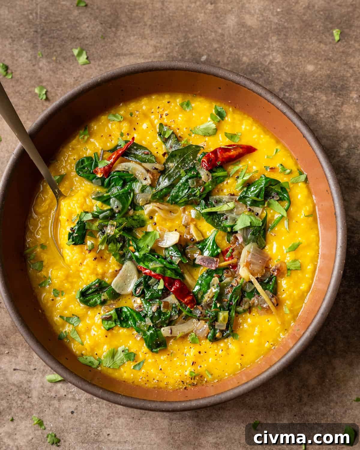 Dal palak in bowl on a table.