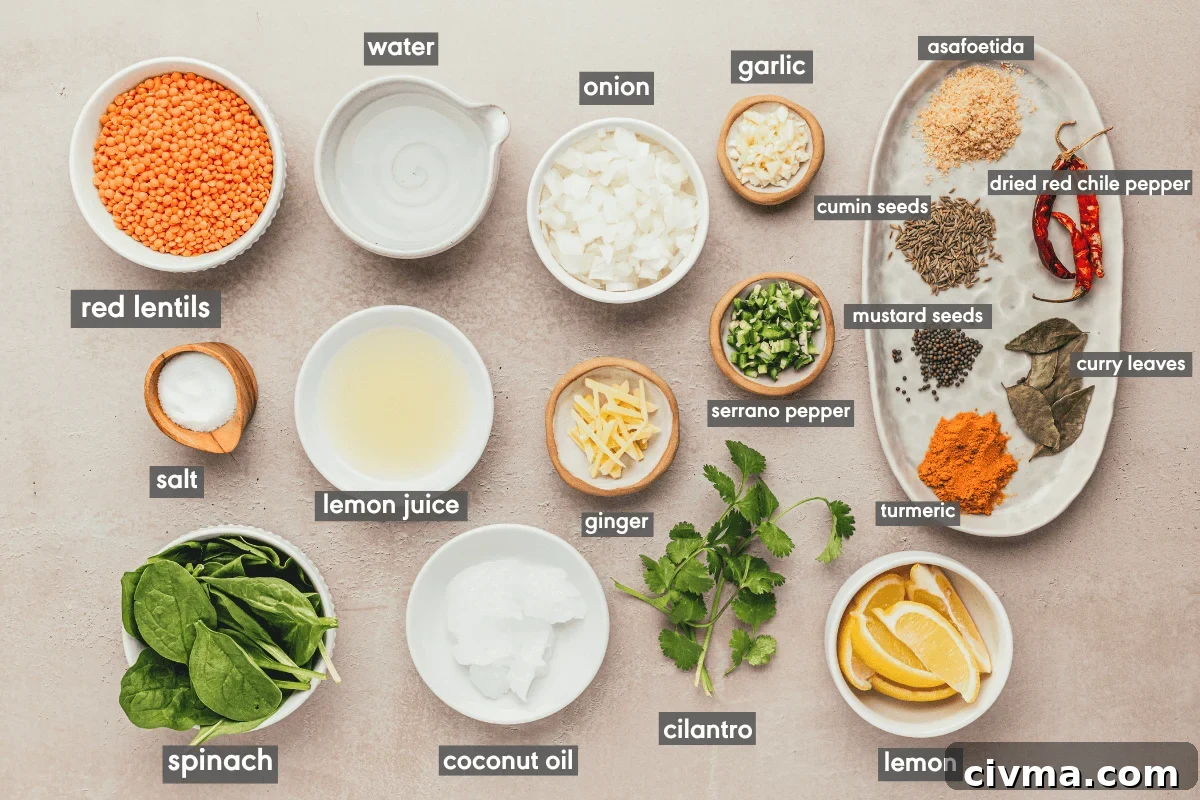 Dal palak ingredients in various small bowls on a table.