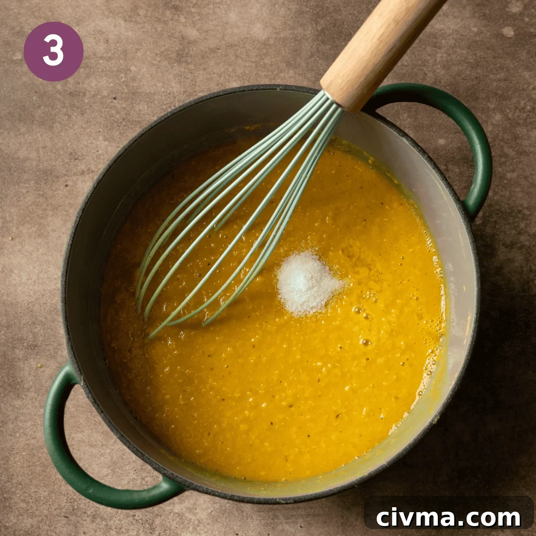 Salt and lemon juice added to cooked lentils.