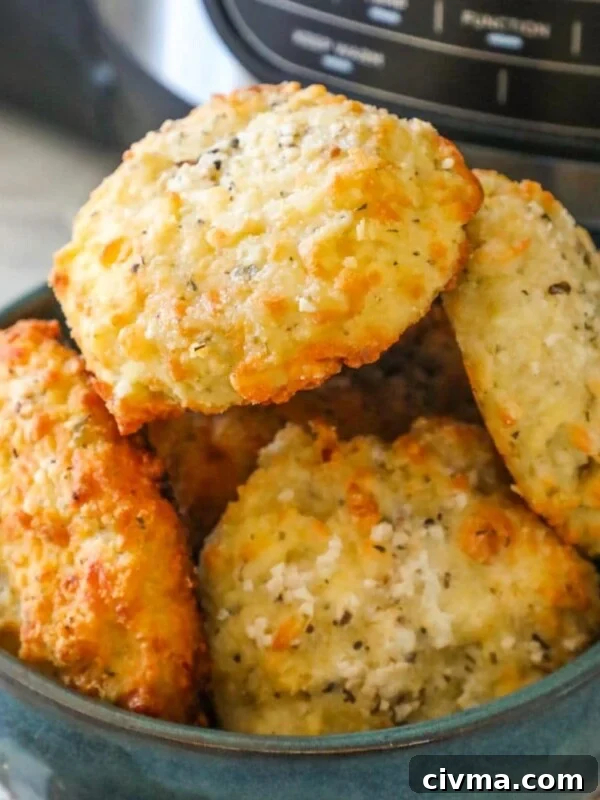 a bowl of rolls stacked in a blue bowl