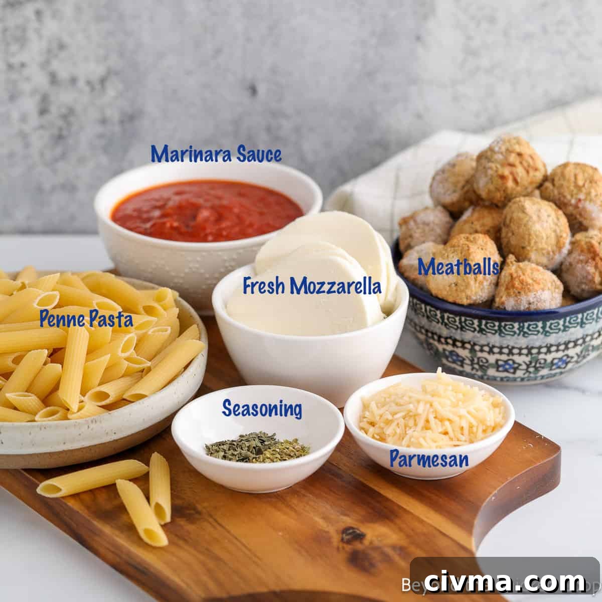 Ingredients in small bowls for making a baked pasta. 