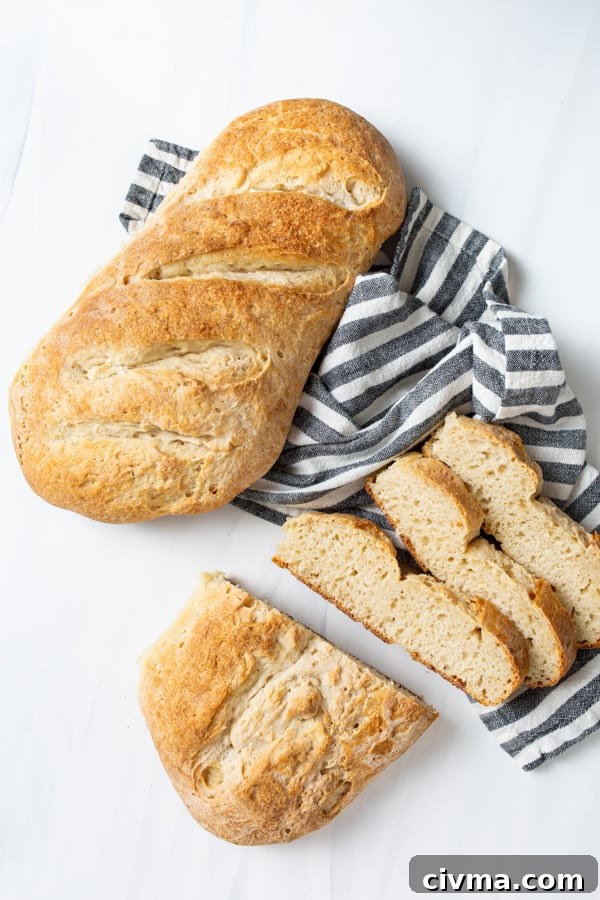 Two loaves of No Yeast Sourdough Bread sitting on a marble serving tray. 