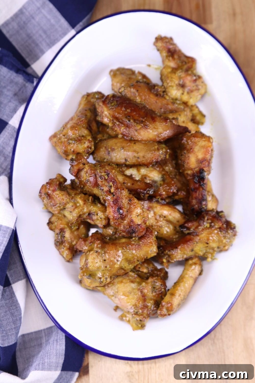 easy grilling appetizer - smoked chicken wings with rosemary mustard sauce Rosemary Mustard Chicken Wings on an oval platter
