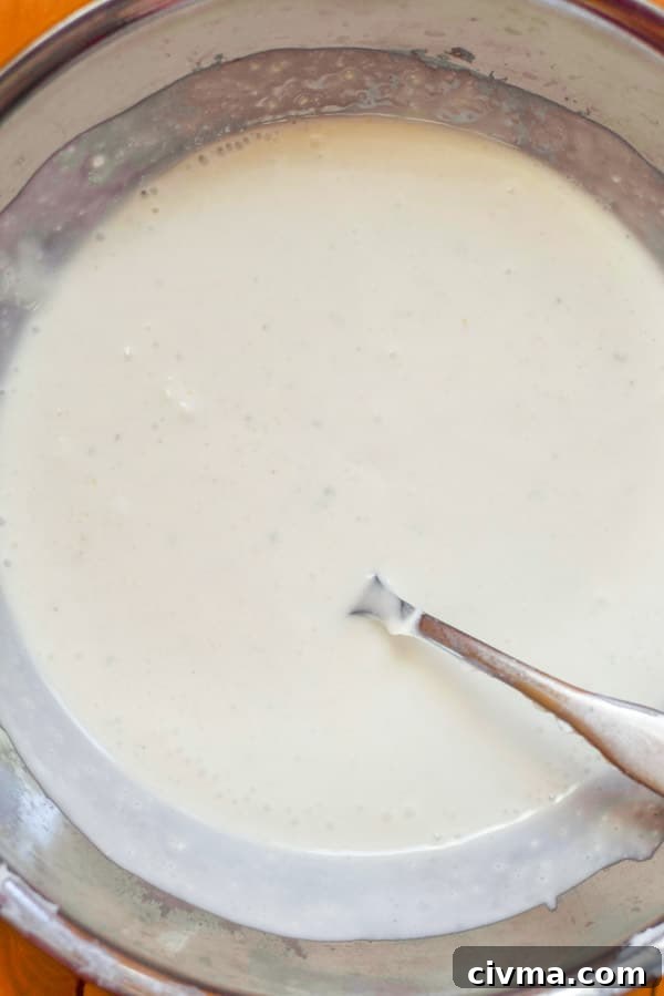All the ingredients mixed in a metal bowl for the dressing