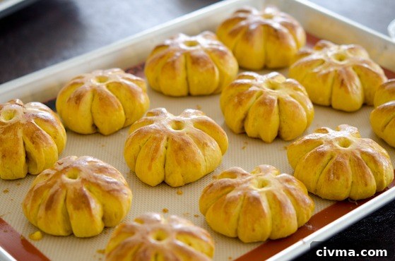 pumpkin dinner rolls baked to a golden brown.