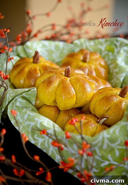 Pumpkin dinner rolls placed in a basket