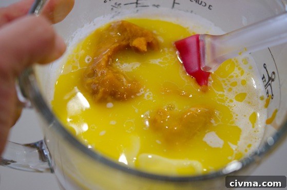 Canned pumpkin added to hot melted butter.