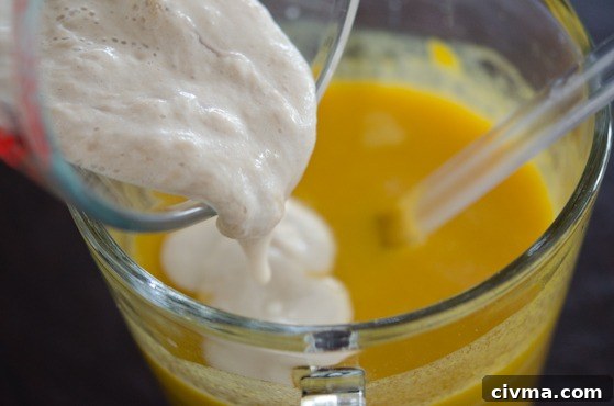 Pour a proofed yeast mixture added to a. pumpkin mixture.