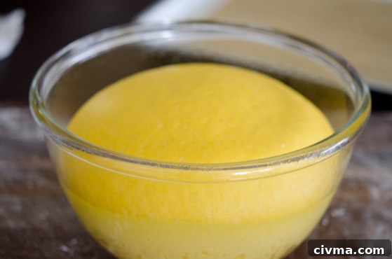 The pumpkin bread dough risen double in volume.