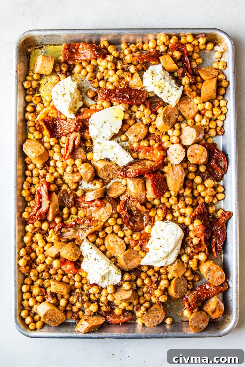 Adding sausage and halloumi to chickpeas