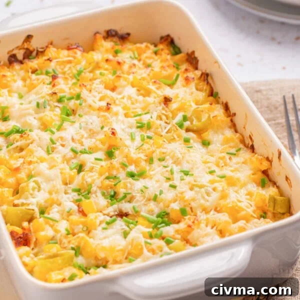 A close up image of corn casserole with cream cheese, ready to be served