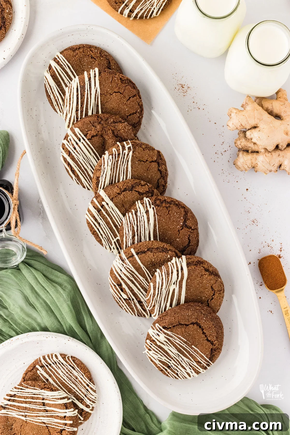 overhead shot of Double Molasses Gluten Free Ginger Cookies (Soft & Chewy) lined up on a long, thin, white serving platter