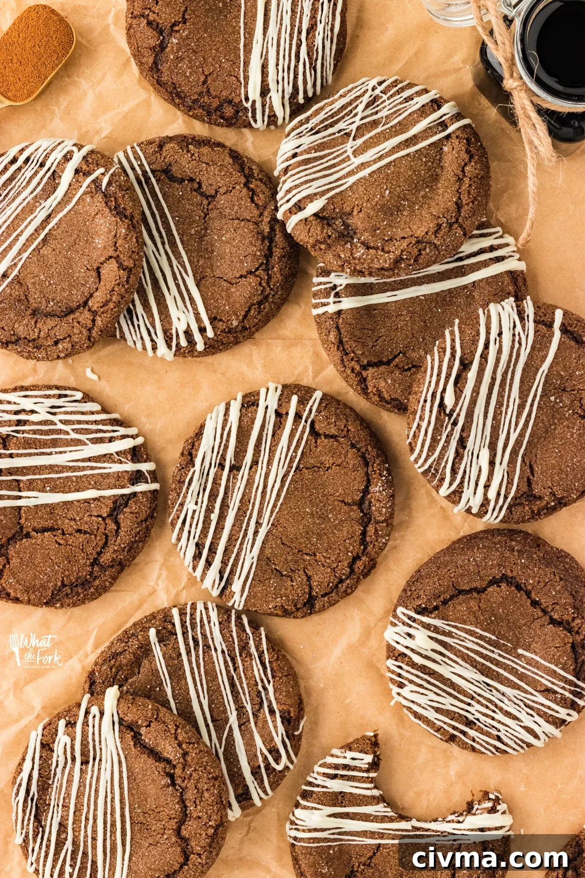 overhead shot of baked gluten free molasses cookies drizzled with white chocolate