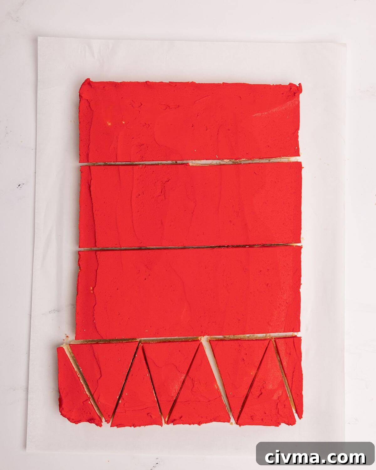 Santa Hat Sugar Cookie Bars for Christmas 10 cutting frosted sugar cookie bars into individual triangles