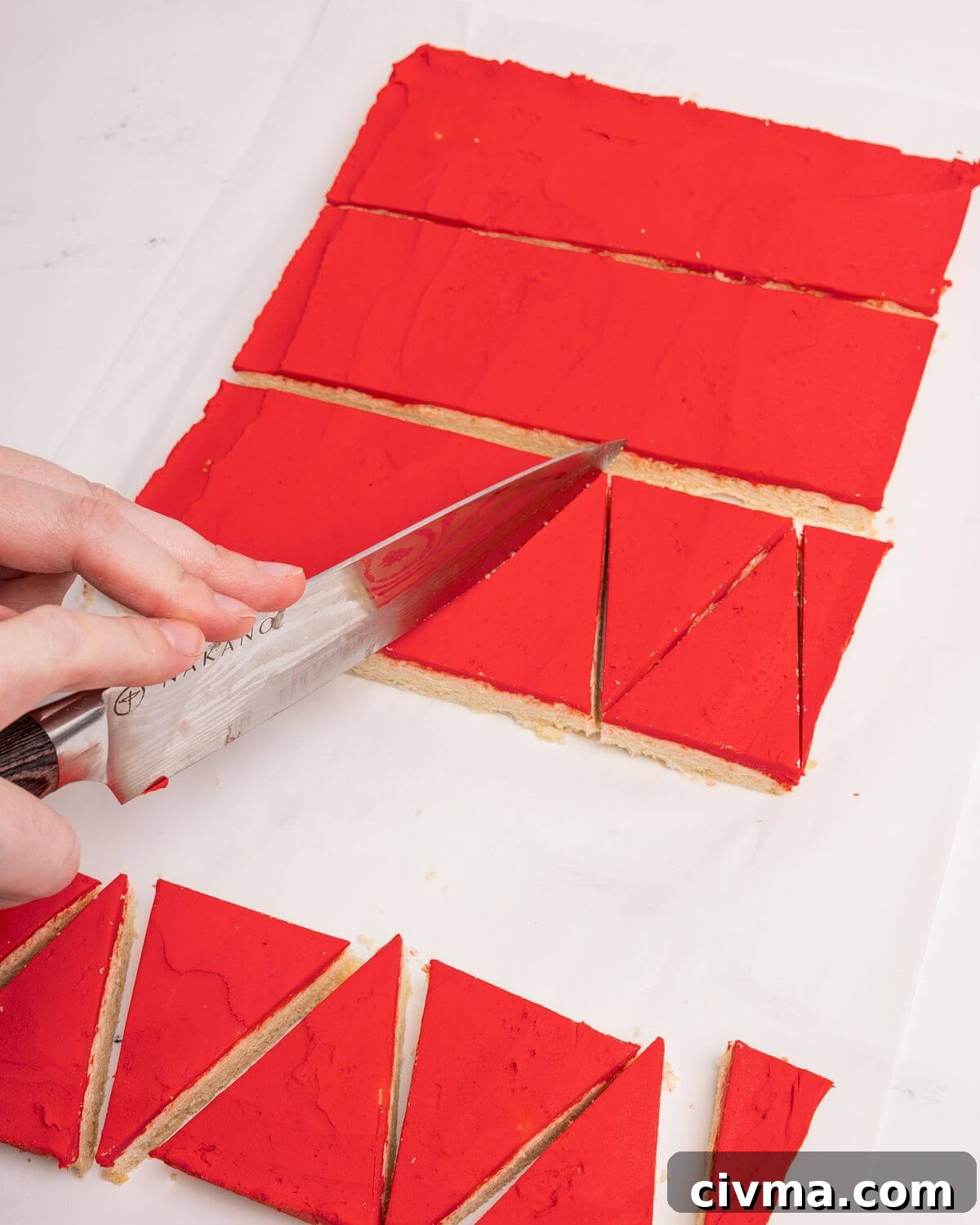 Santa Hat Sugar Cookie Bars for Christmas 3 cutting santa hat sugar cookie bars into triangles