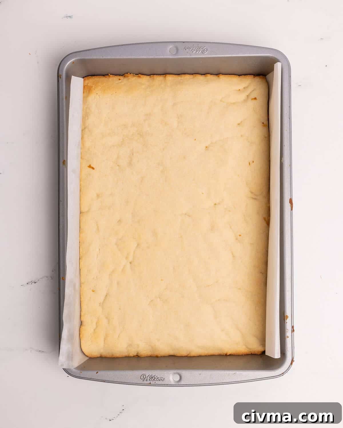 Santa Hat Sugar Cookie Bars for Christmas 5 baked sugar cookie bar recipe in 9x13 metal pan