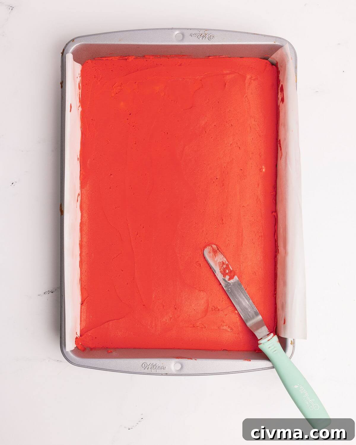 Santa Hat Sugar Cookie Bars for Christmas 7 red frosting spread over sugar cookie bar