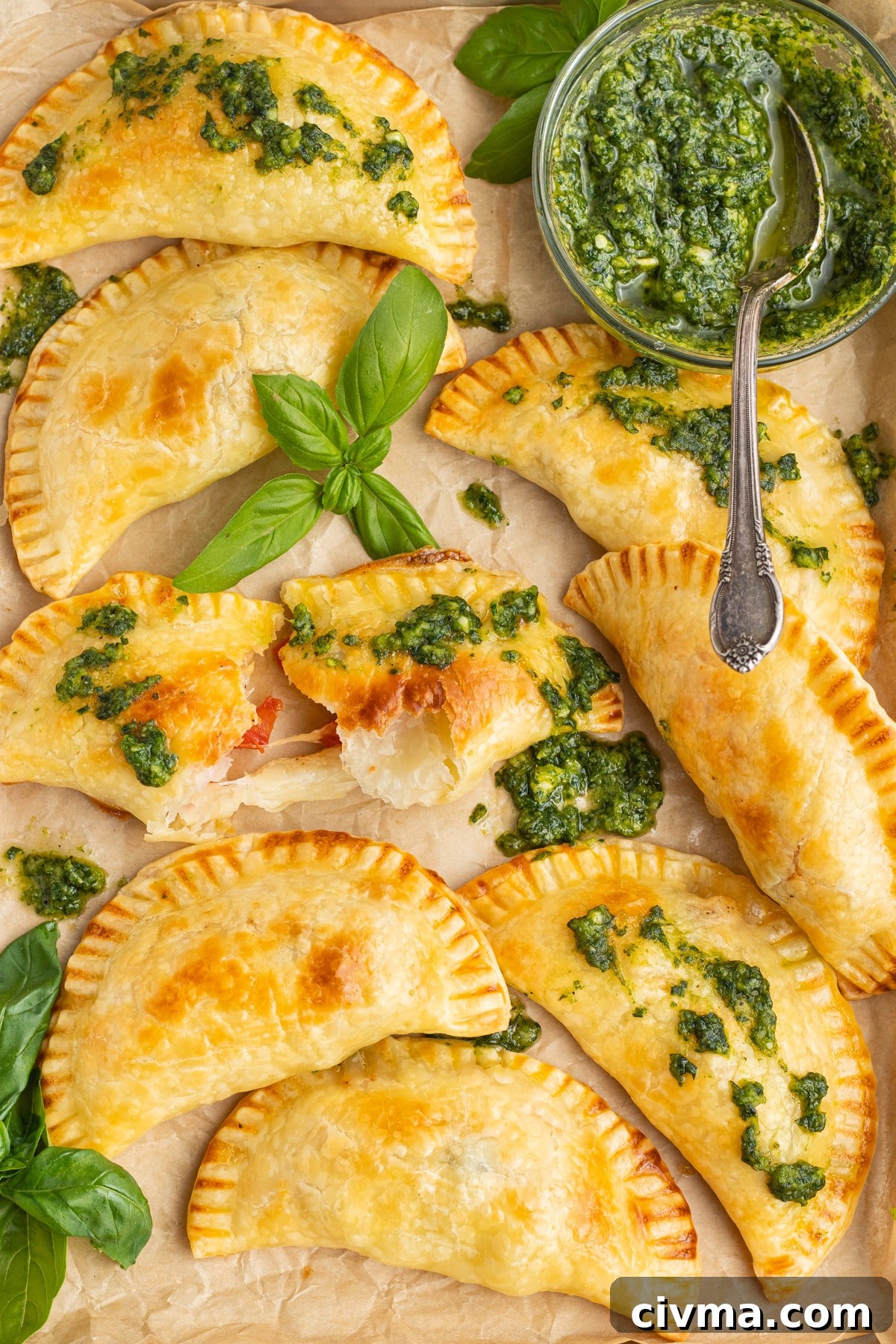 This is a picture of caprese empanadas with pesto. 