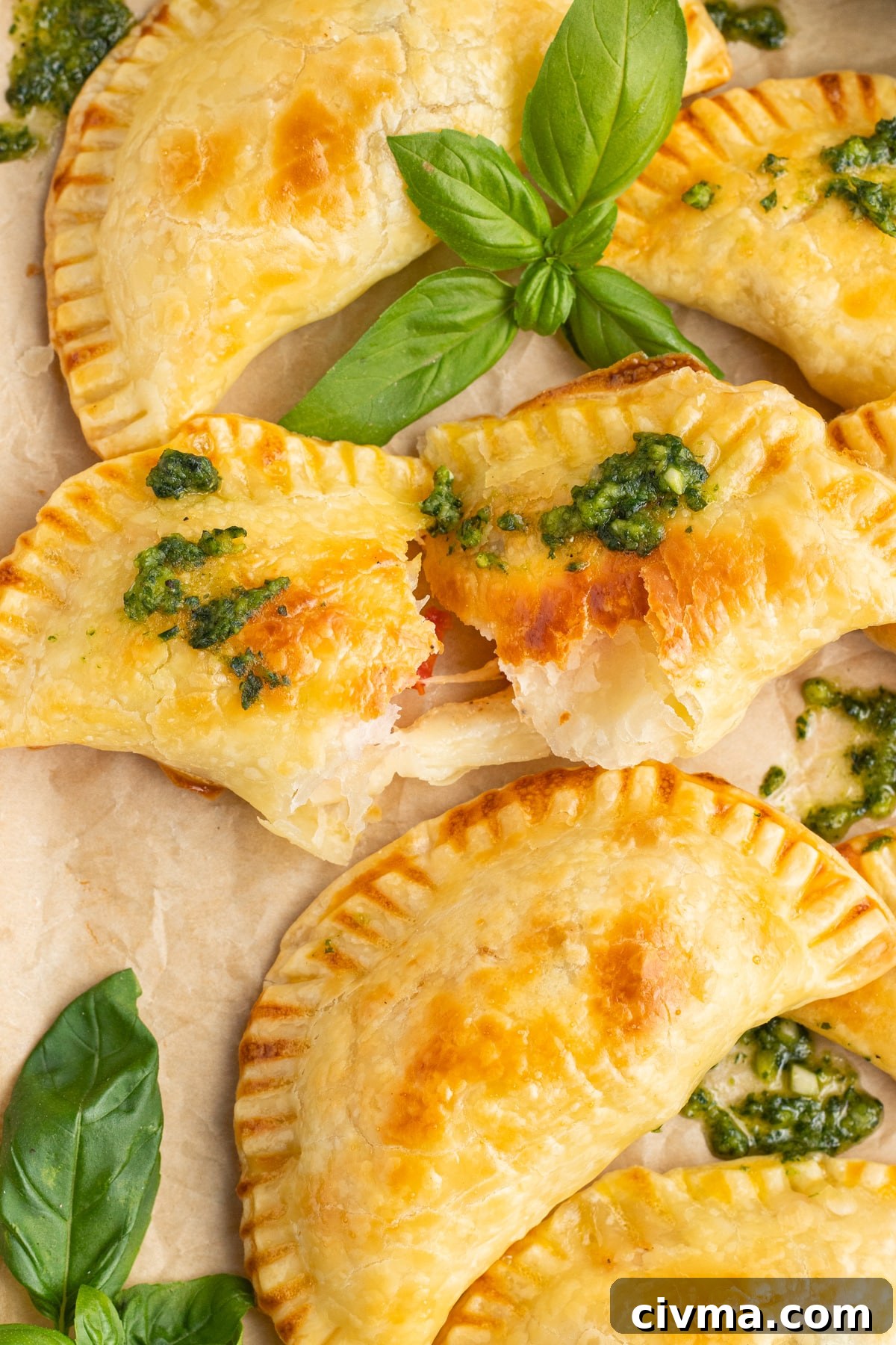 This is a close up picture of an open cheesy empanada. 