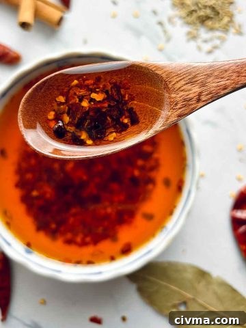 spoon holding chili oil