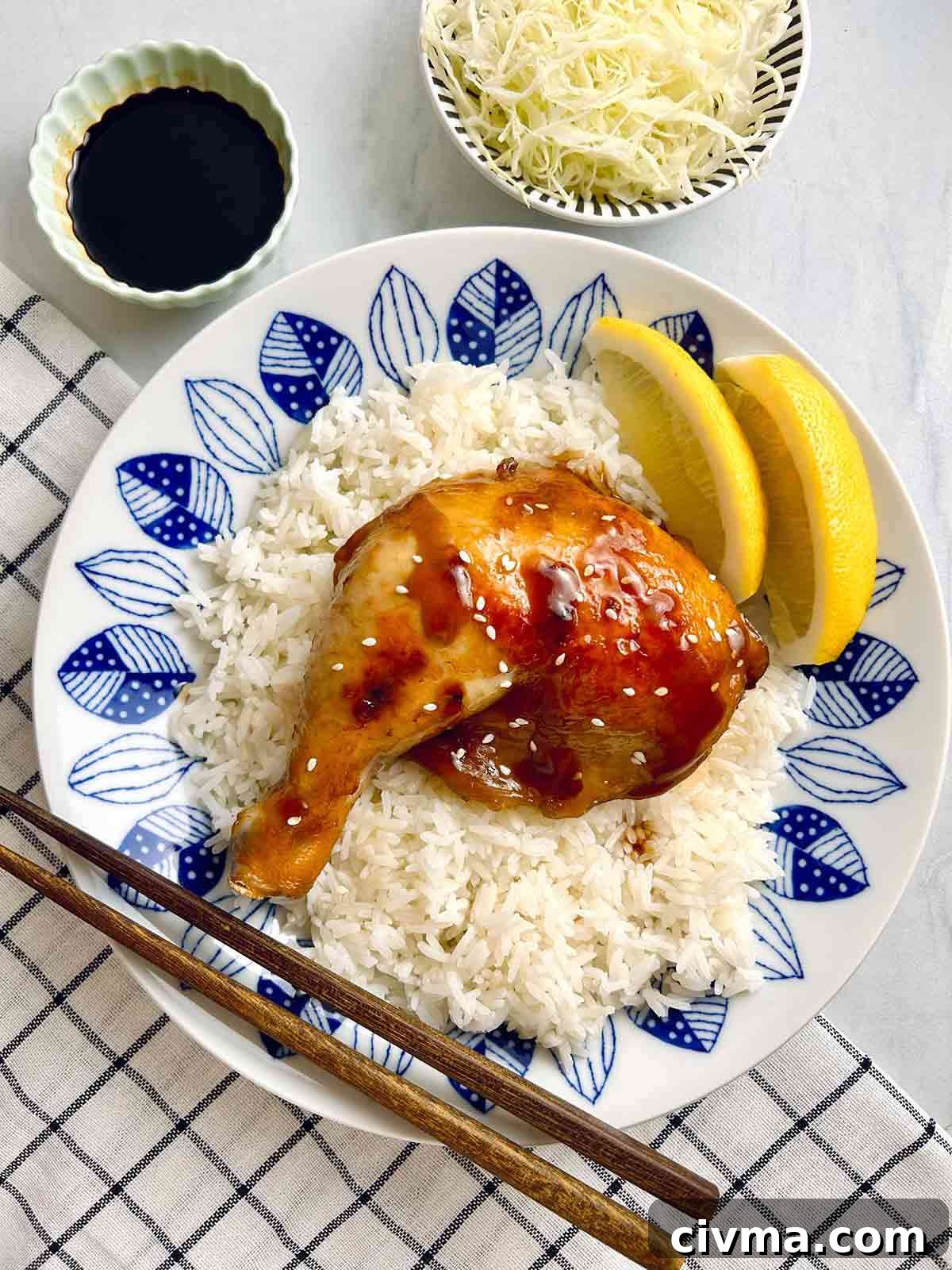 plate of teriyaki chicken on rice