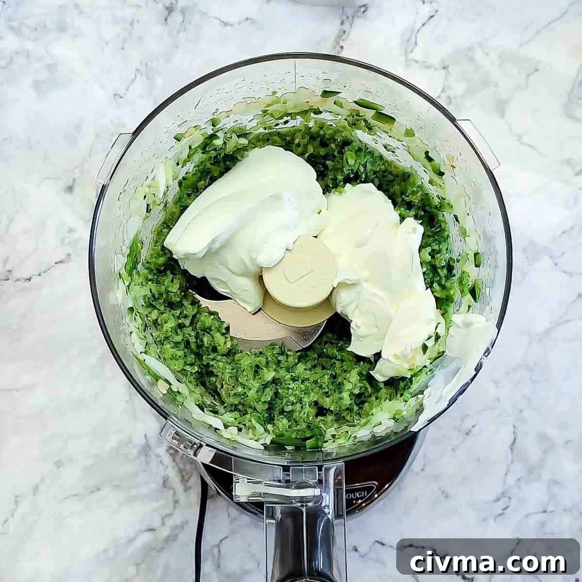 Green Spaghetti with Creamy Poblano Sauce 8 Overhead view of process shot 5 - pulse the food processor a few times to blend the veggies and adding the sour cream.