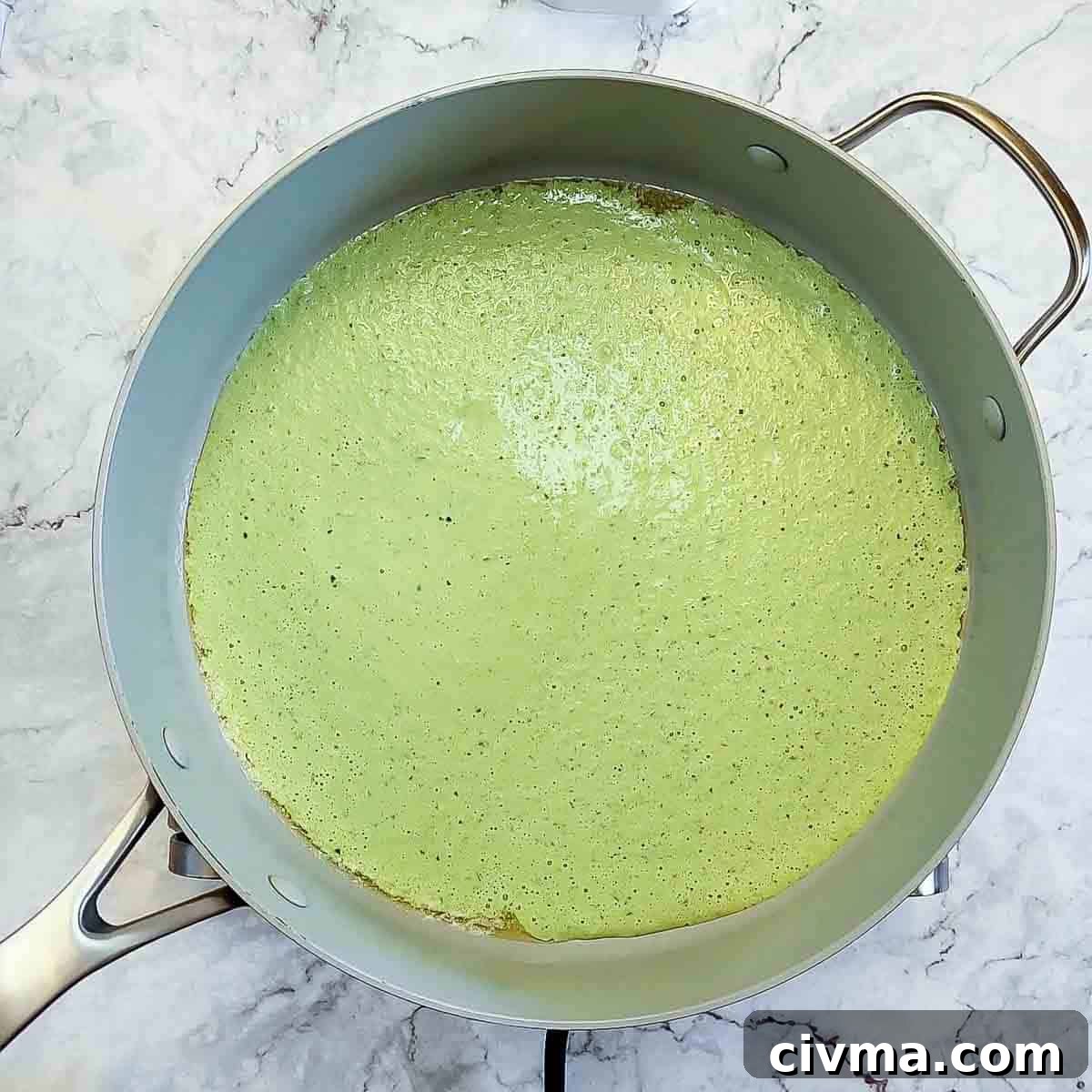 Green Spaghetti with Creamy Poblano Sauce 9 Overhead view of process shot 7 - melt butter in a large saucepan and add in the pepper mixture.