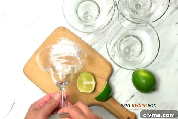 Frozen Kiwi Margaritas 3 Salting rim of margarita glass