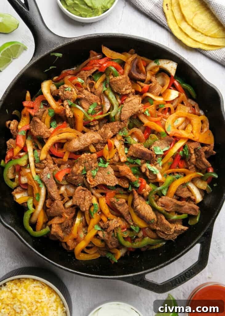 Steak fajita tacos with peppers and onions