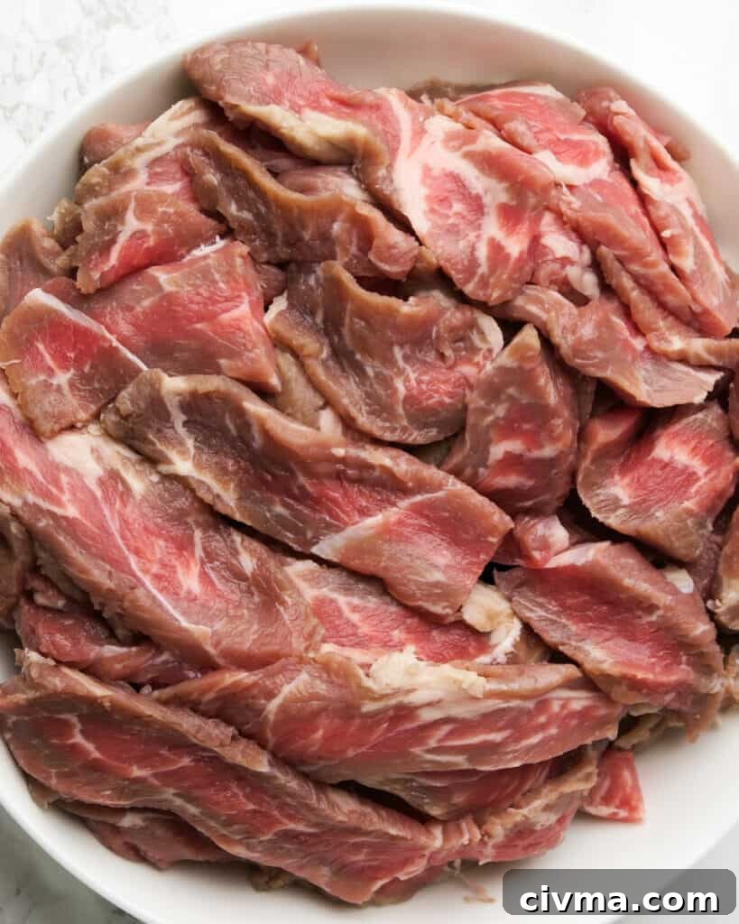 Sliced petite sirloin steak for steak fajitas