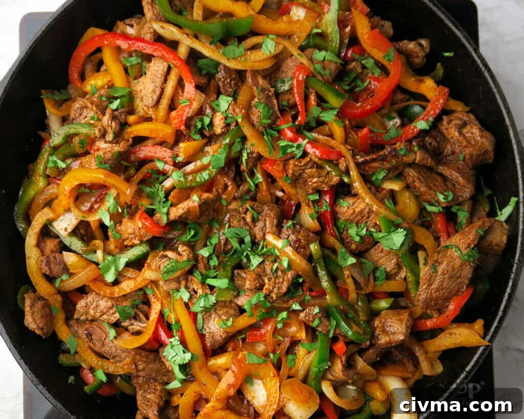 Finished steak fajitas with peppers and onions