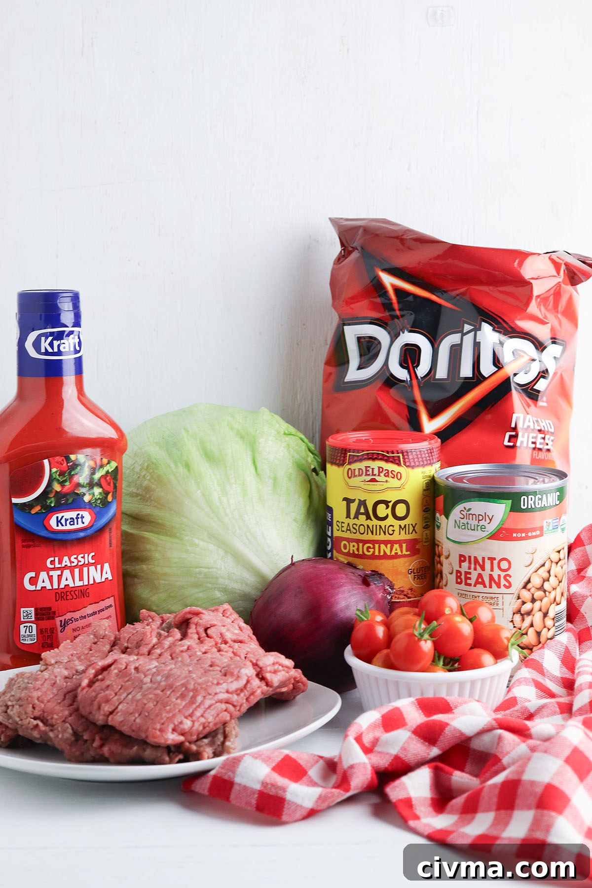 Dorito Taco Salad Recipe with Ground Beef and Catalina Dressing 3 The ingredients to make Dorito taco salad are set out on the counter.