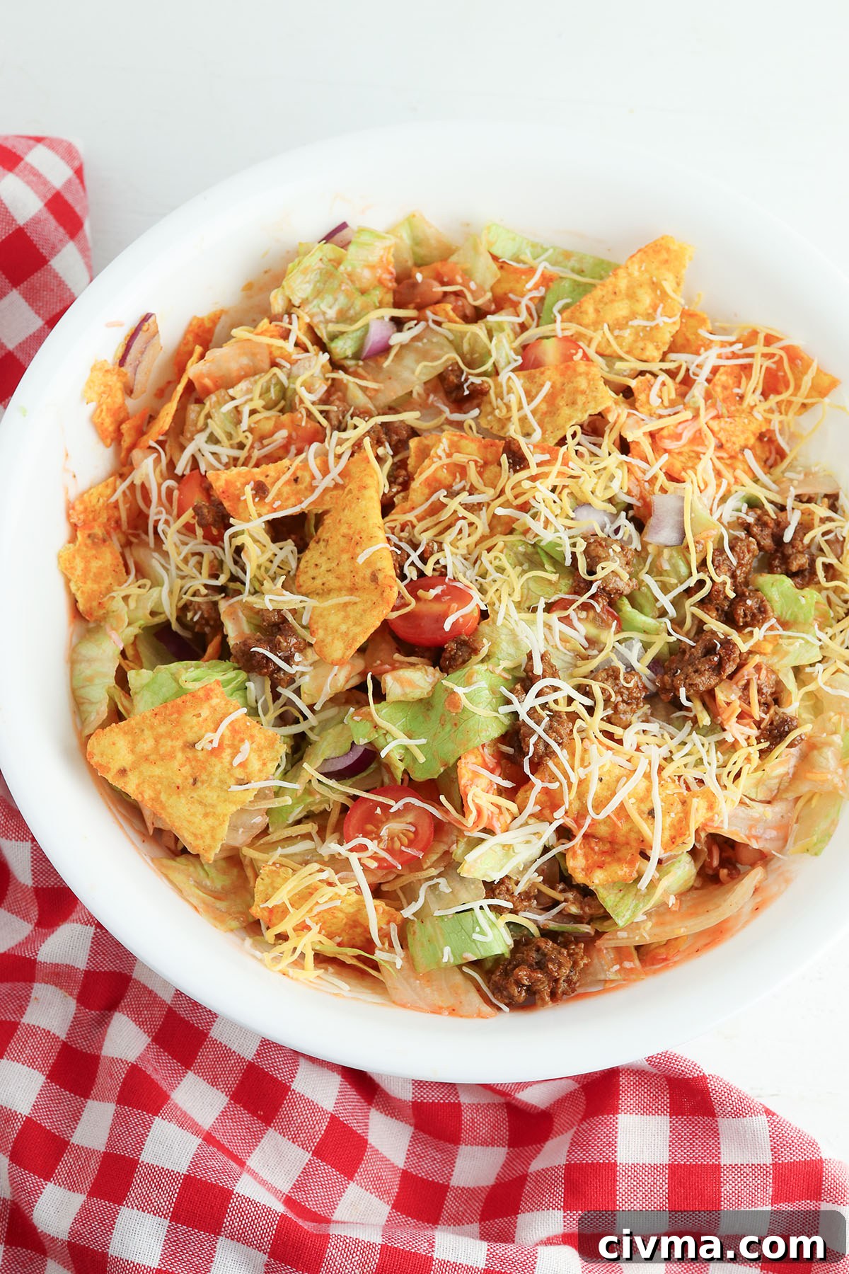 Dorito Taco Salad Recipe with Ground Beef and Catalina Dressing 7 Dorito Taco Salad tossed in large bowl.