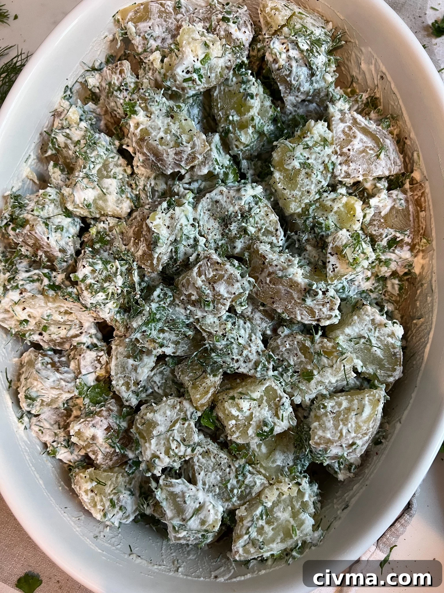 Potato salad mixed together.