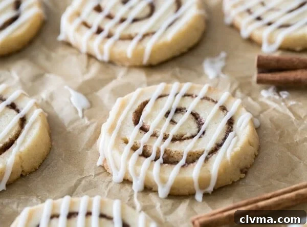 cinnamon roll cookies on parchment paper