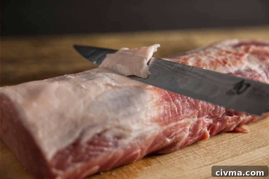 Pork Loin Smoking Time Per Pound and Temperature 4 Trimming excess fat from pork loin.