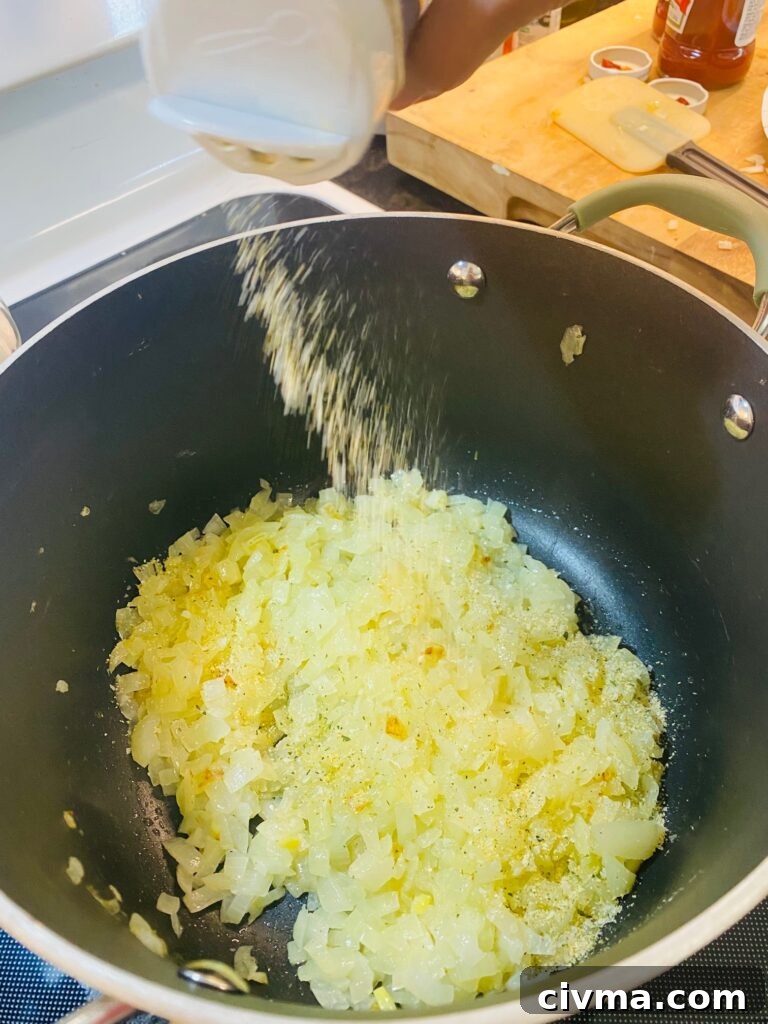 adding seasoning to the sauce