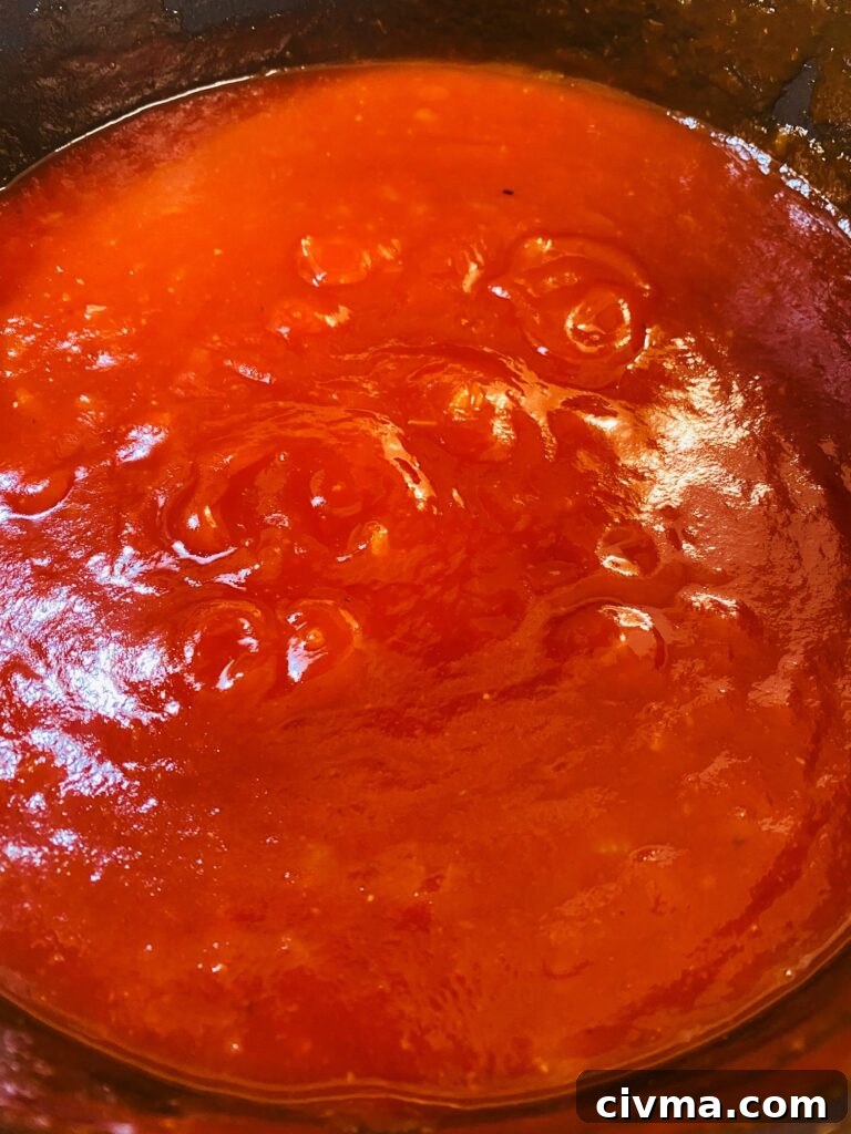 Grandma's Homemade BBQ Sauce simmering in a pot