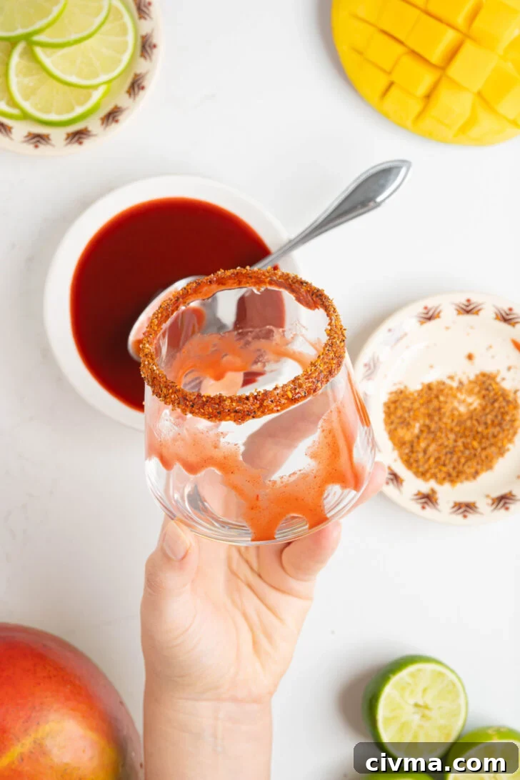 A glass with a tajin rim.